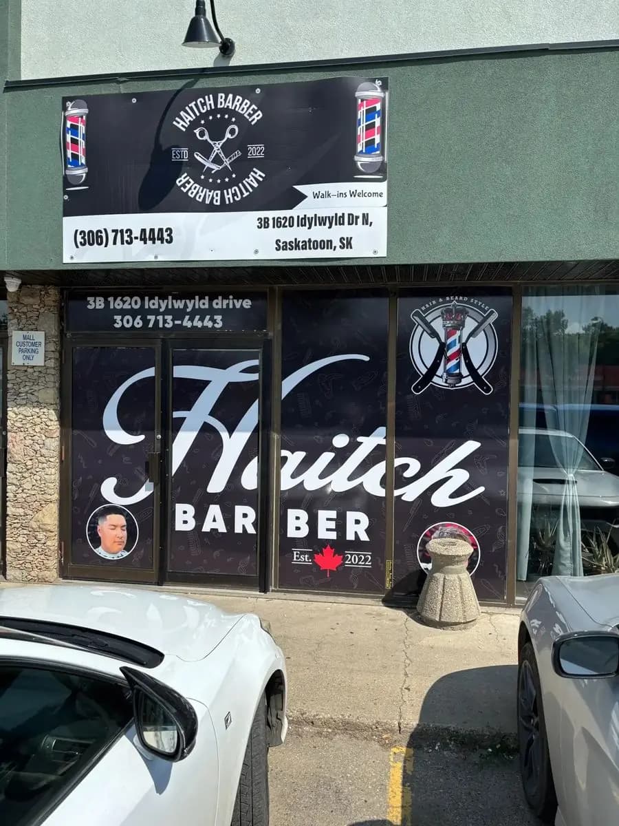 Hutch Barber storefront window decals installed in Saskatoon